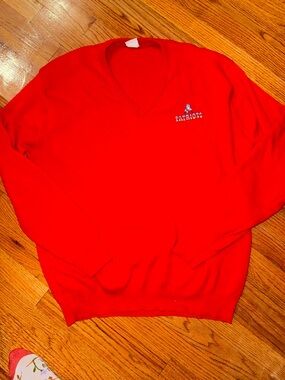 Vintage red New England Patriots V-neck sweater featuring the "Pat Patriot" logo